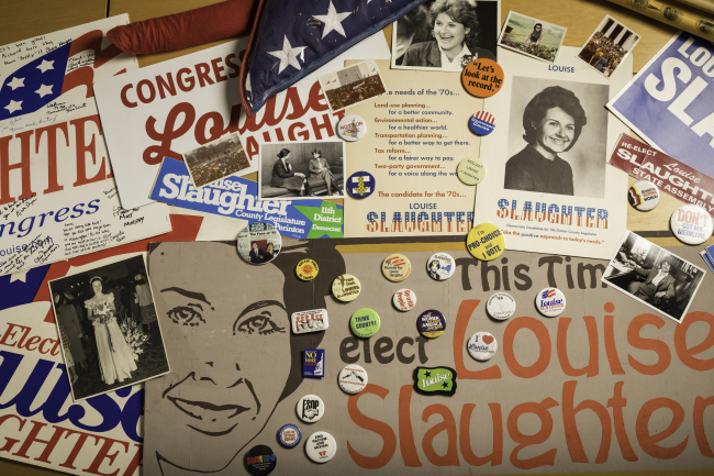A collage of pins, bumper stickers, and other materials associated with Louise Slaughter