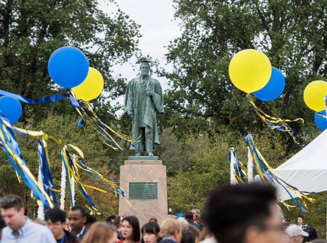 Statue of Martin Brewer Anderson surrounded by blue and yellow balloons