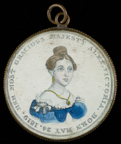 A pendant with an illustration of Queen Victoria on it