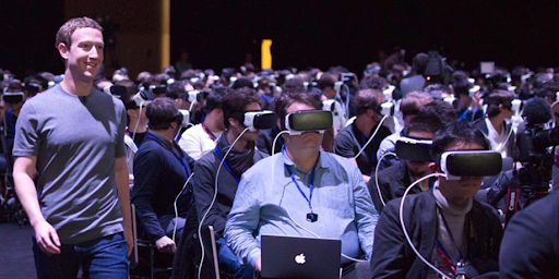 Mark Zuckerberg, CEO of Meta, at a 2016 conference, in which everyone is wearing a VR headset.