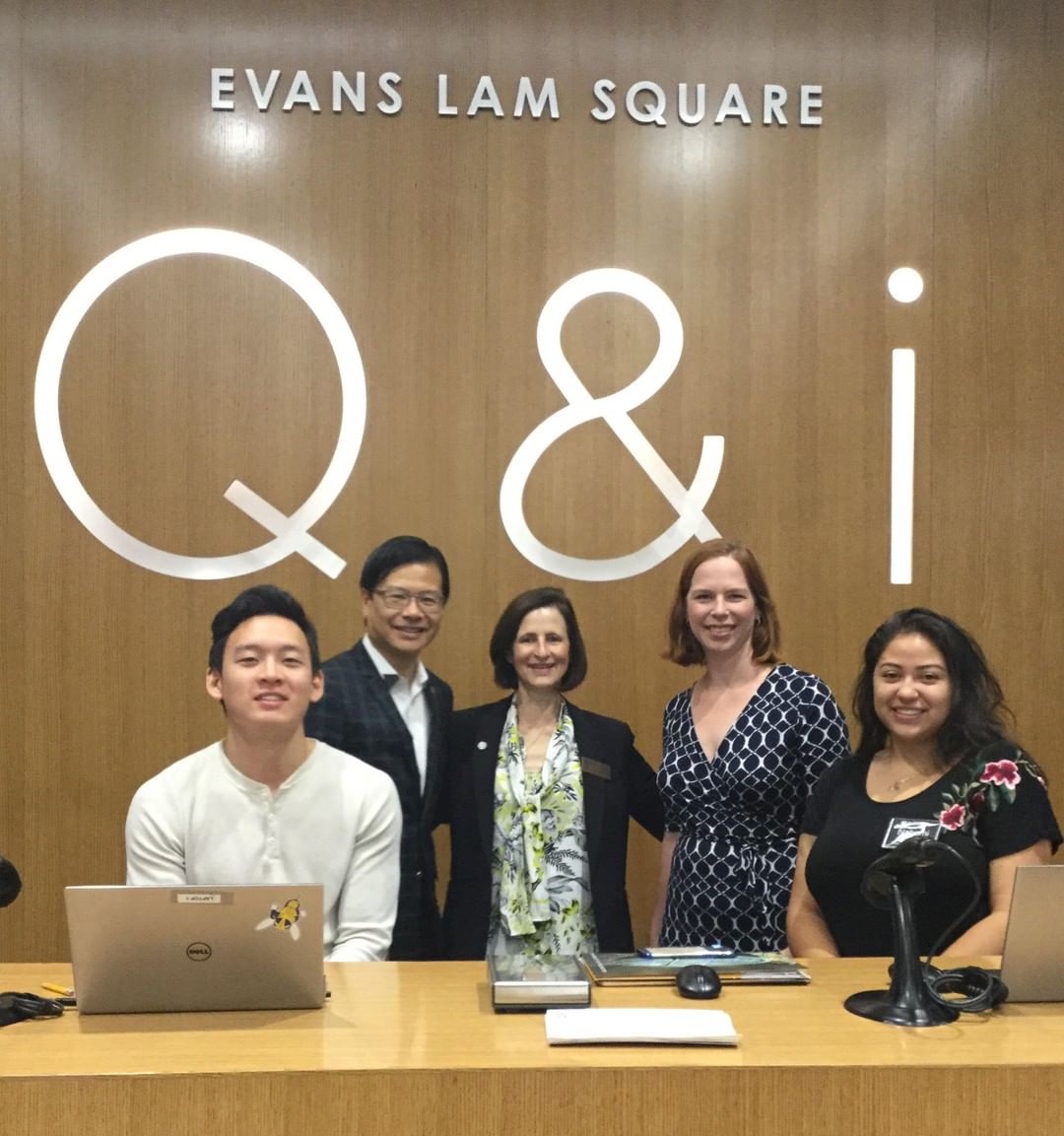 Q&i desk with Evans Lam, Mary Ann Mavrinac and other staff