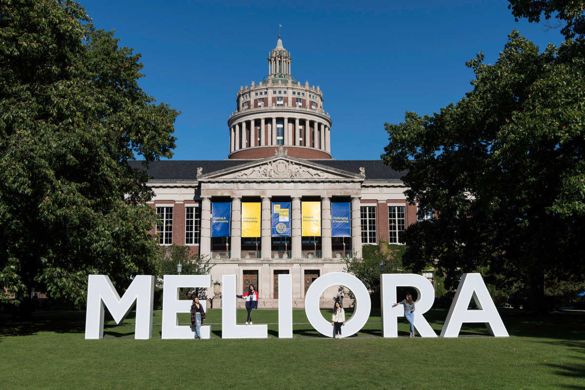 Large letters spelling out MELIORA in the quad in front of Rush Rhees Library
