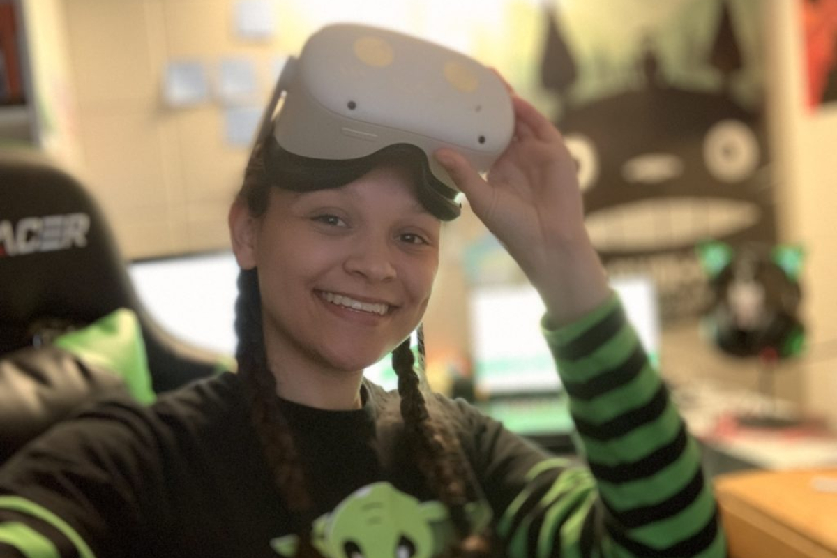 author Ayiana Crabtree wearing a VR headset.