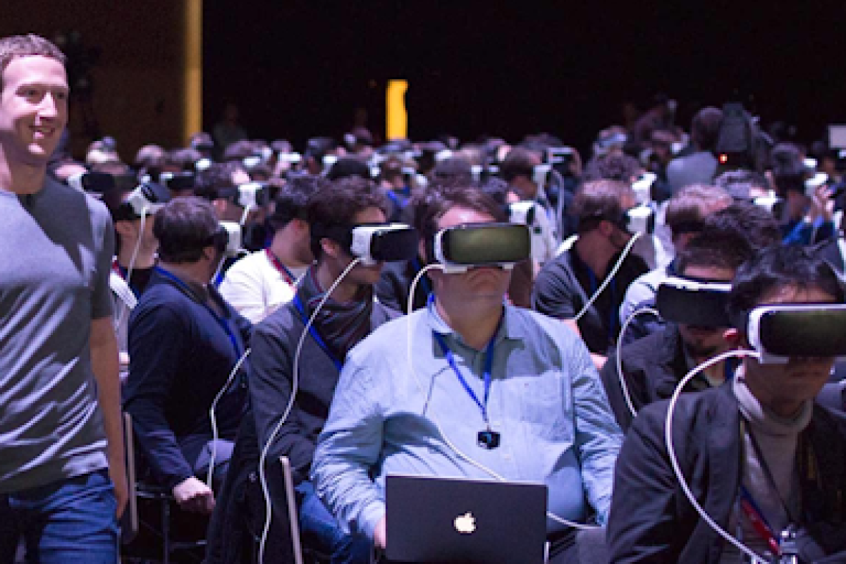 Mark Zuckerberg, CEO of Meta, at a 2016 conference, in which everyone is wearing a VR headset.