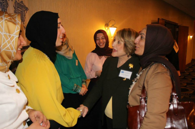 Louise Slaughter shaking hands with an Afghani woman