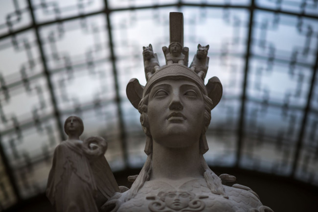 The top portion of the statue of Athena located in the foyer area outside the Great Hall in Rush Rhees Library