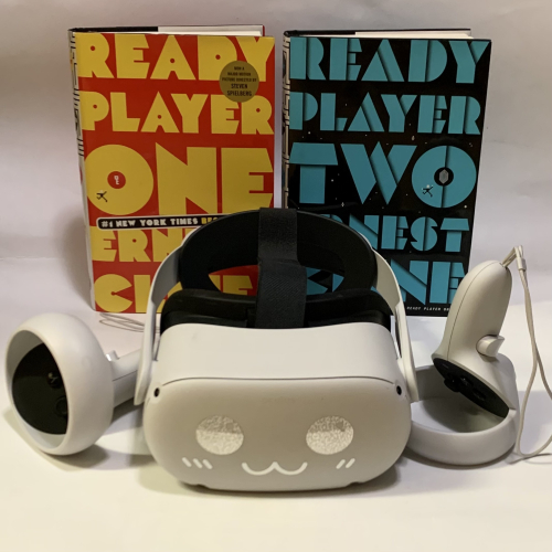 A VR headset positioned in front of the books "Ready Player One" and "Ready Player Two."