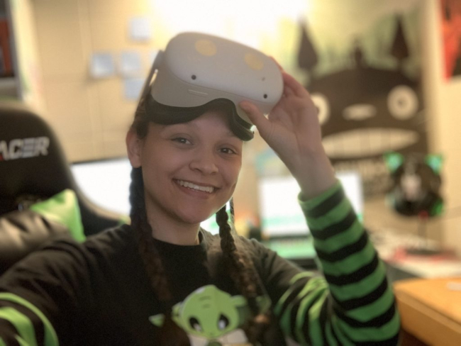 author Ayiana Crabtree wearing a VR headset.