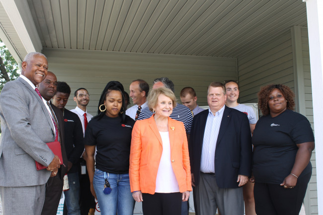 Louise Slaughter with a group of people at a YouthBuild site