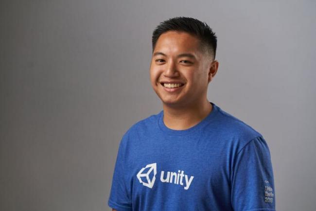 Carl Domingo, wearing a blue Unity shirt