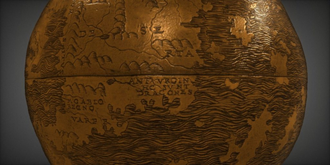 Detail of the globe. Close to a body of water, a hilly land area is labeled with the text "HIC SUNT DRACONES" (Here be dragons)