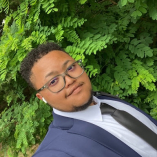 Photo of person, Darnell King, outdoors facing the camera