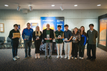 winners posing with their prizes
