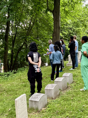 students and staff touring Mt. Hope Cemetery.