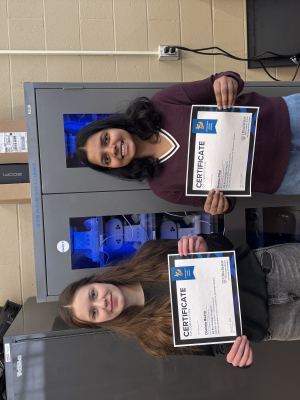 Greenhouse students holding their certificates. 
