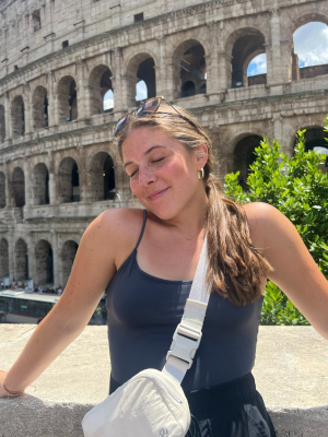 Liv Ritz posing in front of the Colosseum in Rome, Italy.